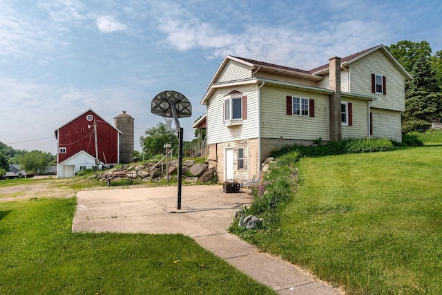 4884 Brewery Rd, Cross Plains, WI 53528 - back of property with a barn, a lawn, and an outdoor structure