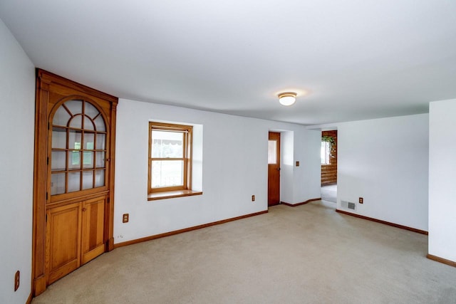 4884 Brewery Rd, Cross Plains, WI 53528 - spare room with light colored carpet and baseboards