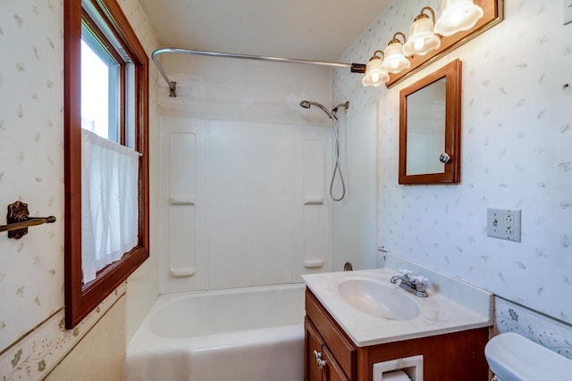 4884 Brewery Rd, Cross Plains, WI 53528 - bathroom featuring wallpapered walls, toilet, vanity, and shower / washtub combination
