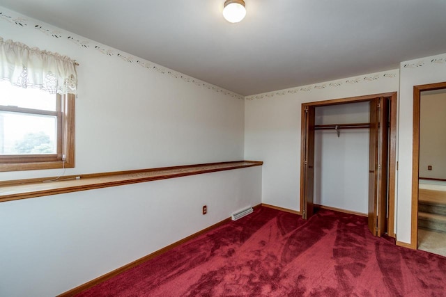 4884 Brewery Rd, Cross Plains, WI 53528 - unfurnished bedroom featuring a closet, dark colored carpet, and baseboards