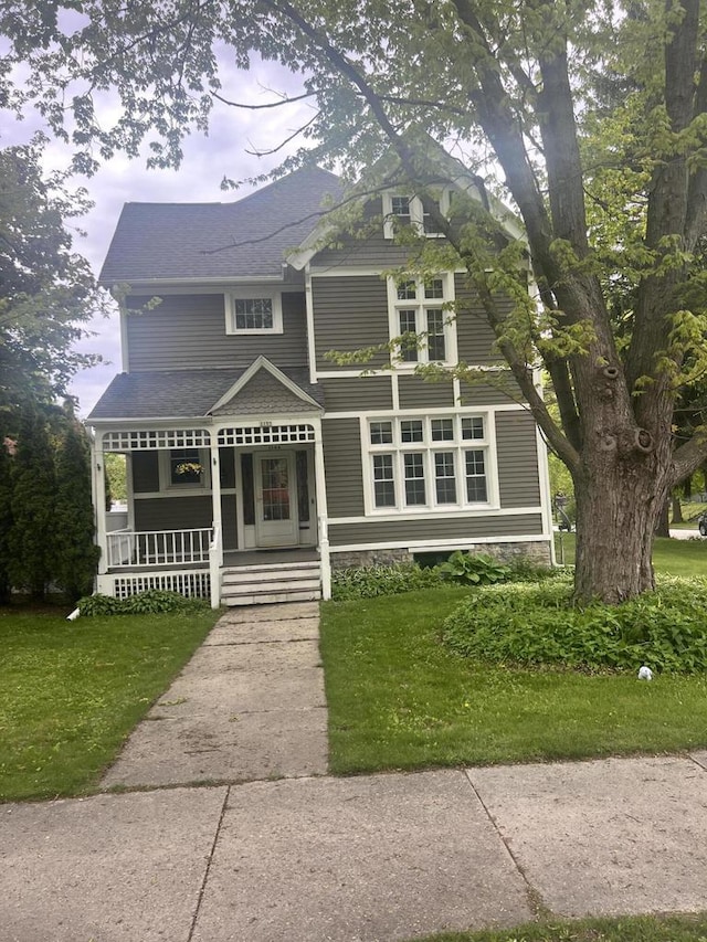 1105 N 6th St, Sheboygan, WI 53081 - view of front of home with covered porch and a front yard