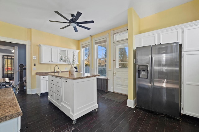 1105 N 6th St, Sheboygan, WI 53081 - kitchen featuring stainless steel appliances, a ceiling fan, white cabinets, and dark wood-style flooring