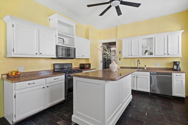 1105 N 6th St, Sheboygan, WI 53081 - kitchen with open shelves, black gas range oven, dishwasher, a ceiling fan, and white cabinetry