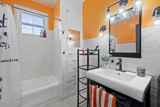 1105 N 6th St, Sheboygan, WI 53081 - bathroom featuring tile walls, shower / bath combination with curtain, a wainscoted wall, and tile patterned flooring