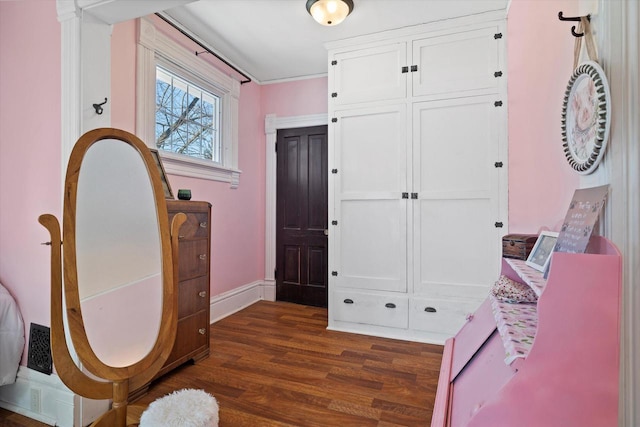 1105 N 6th St, Sheboygan, WI 53081 - bedroom with dark wood finished floors, baseboards, and a closet