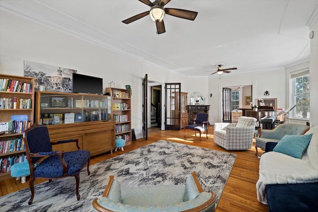 1105 N 6th St, Sheboygan, WI 53081 - living room with ceiling fan, wood finished floors, and crown molding