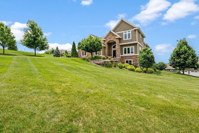 3403 Whistling Wind Way, Sun Prairie, WI 53590 - view of front facade featuring stone siding, a front yard, and stucco siding