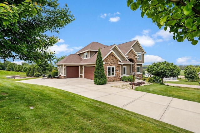 3403 Whistling Wind Way, Sun Prairie, WI 53590 - craftsman-style home featuring stone siding, a garage, a front yard, and driveway