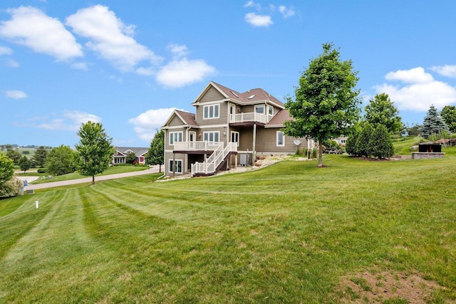 3403 Whistling Wind Way, Sun Prairie, WI 53590 - view of front of property featuring a front yard, stairway, and a wooden deck