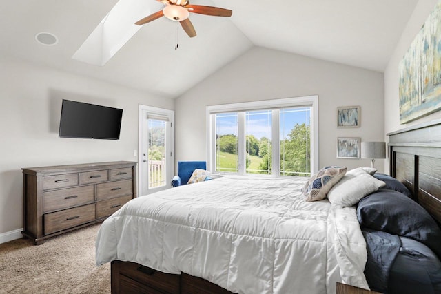 3403 Whistling Wind Way, Sun Prairie, WI 53590 - bedroom with access to outside, lofted ceiling, light colored carpet, a ceiling fan, and a fireplace