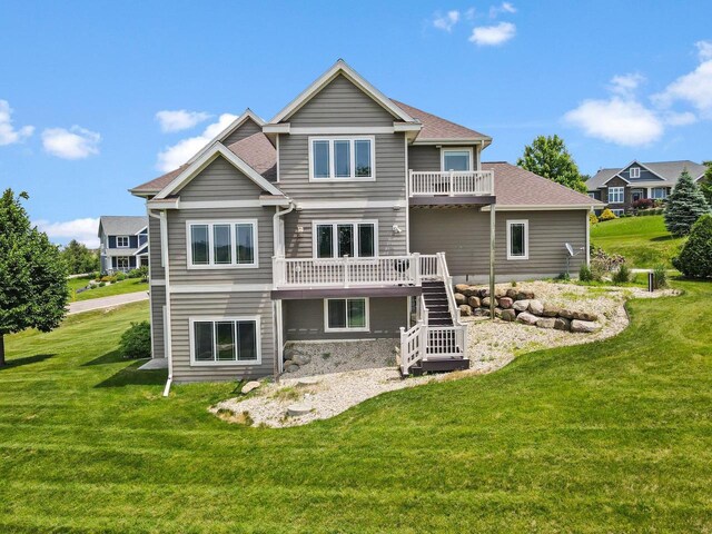 3403 Whistling Wind Way, Sun Prairie, WI 53590 - back of house featuring stairway, a lawn, a wooden deck, and a balcony