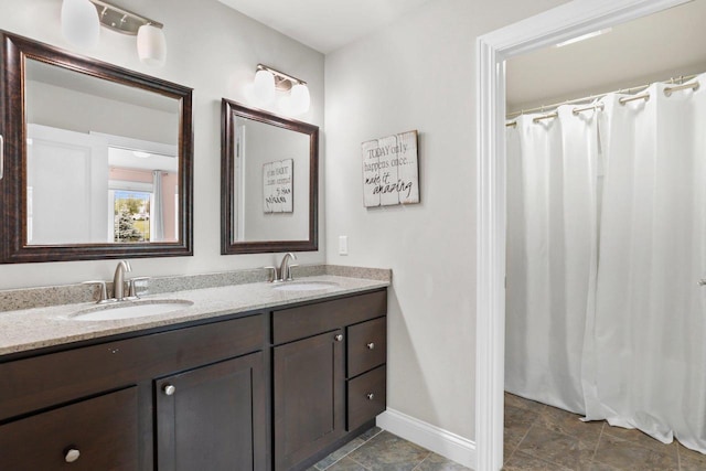 3403 Whistling Wind Way, Sun Prairie, WI 53590 - full bathroom with double vanity, stone finish flooring, and curtained shower