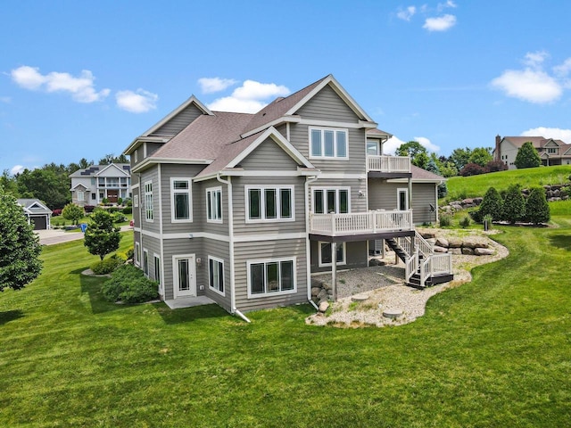 3403 Whistling Wind Way, Sun Prairie, WI 53590 - back of property featuring a lawn, stairs, a wooden deck, and roof with shingles
