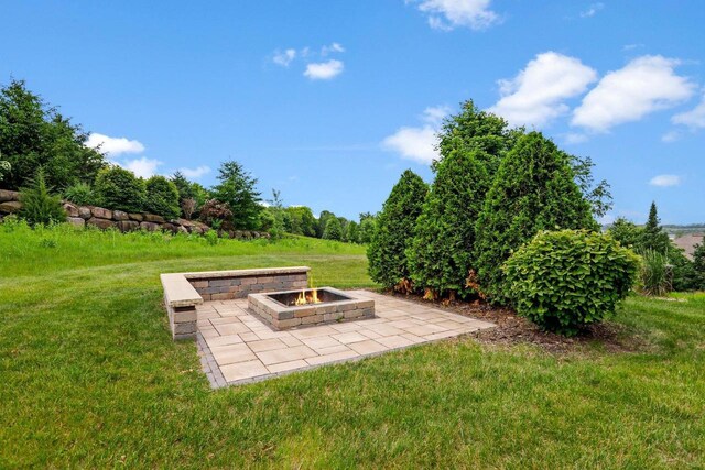 3403 Whistling Wind Way, Sun Prairie, WI 53590 - view of grassy yard featuring a fire pit and a patio