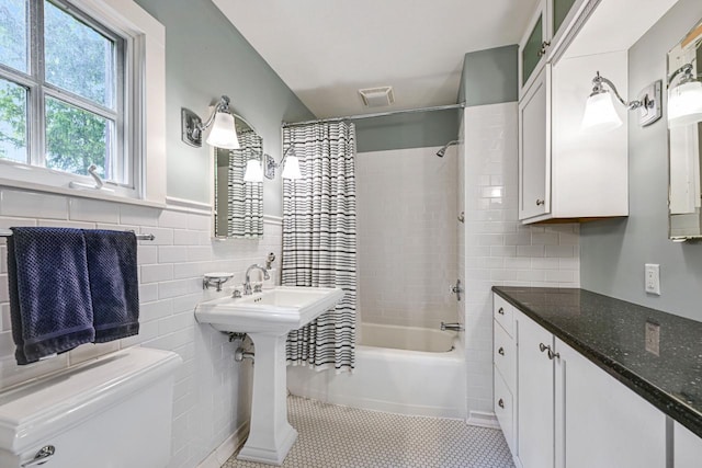 933 Juneau Dr, Fontana, WI 53125 - bathroom with tile walls, toilet, shower / bath combo, and a sink
