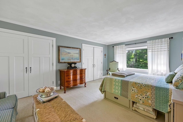 933 Juneau Dr, Fontana, WI 53125 - bedroom featuring light carpet, multiple closets, and crown molding