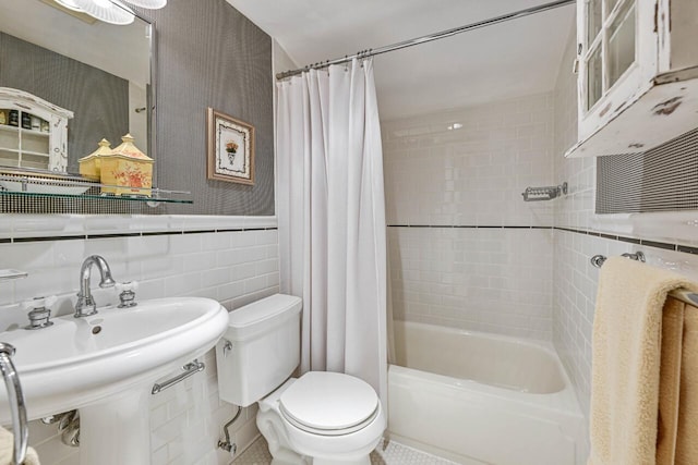 933 Juneau Dr, Fontana, WI 53125 - full bathroom with toilet, shower / bath combo, tile walls, a sink, and wainscoting