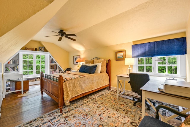 933 Juneau Dr, Fontana, WI 53125 - bedroom with wood finished floors, an office area, lofted ceiling, and a ceiling fan