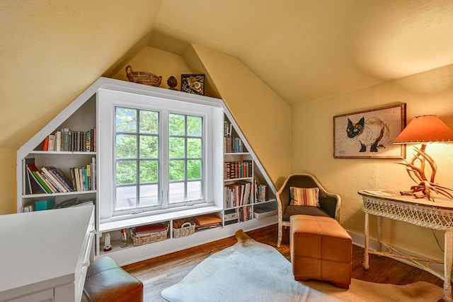 933 Juneau Dr, Fontana, WI 53125 - sitting room with lofted ceiling and wood finished floors