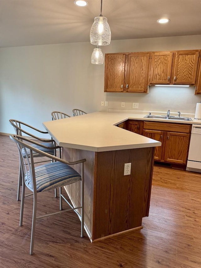 166 Southlake Cir, Fond Du Lac, WI 54935 - kitchen featuring dishwasher, a kitchen breakfast bar, a sink, a peninsula, and recessed lighting