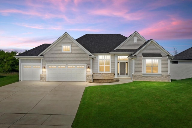 1279 E Hickory Creek Ct, Oak Creek, WI 53154 - view of front of home with a yard, driveway, stone siding, a garage, and a shingled roof