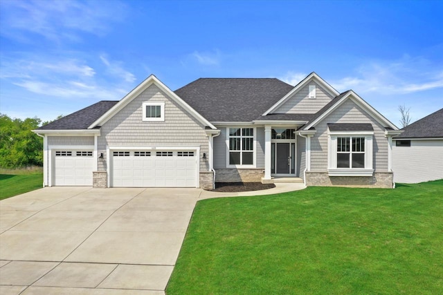 1279 E Hickory Creek Ct, Oak Creek, WI 53154 - craftsman house featuring driveway, a front yard, an attached garage, and a shingled roof