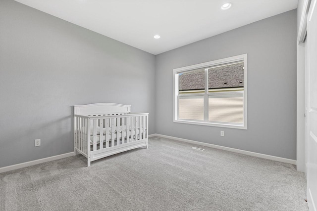 1279 E Hickory Creek Ct, Oak Creek, WI 53154 - carpeted bedroom with baseboards, recessed lighting, and a crib