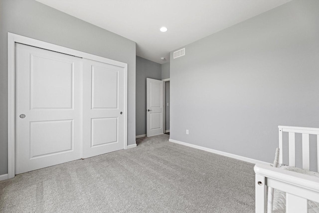 1279 E Hickory Creek Ct, Oak Creek, WI 53154 - unfurnished bedroom with carpet floors, a closet, baseboards, and recessed lighting