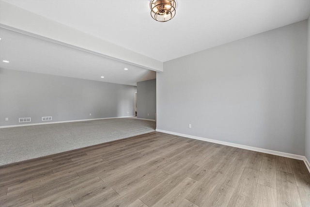 1279 E Hickory Creek Ct, Oak Creek, WI 53154 - spare room featuring wood finished floors, baseboards, and recessed lighting