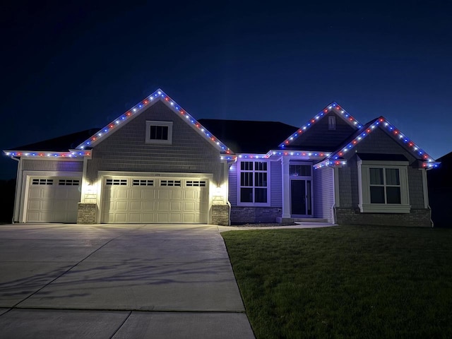 1279 E Hickory Creek Ct, Oak Creek, WI 53154 - view of front of property featuring an attached garage, driveway, a yard, and stone siding