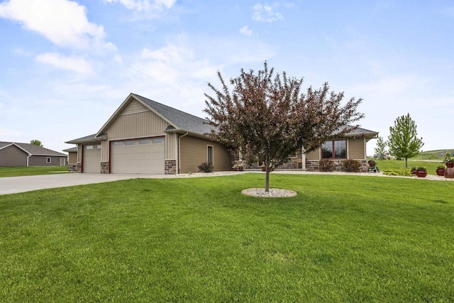 W7535 Cross Country Ln, Hortonville, WI 54944 - view of front of house featuring stone siding, a front yard, an attached garage, and driveway