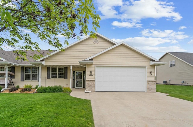 536 Coonen Dr, Combined Locks, WI 54113 - single story home with concrete driveway, a front yard, an attached garage, brick siding, and central AC