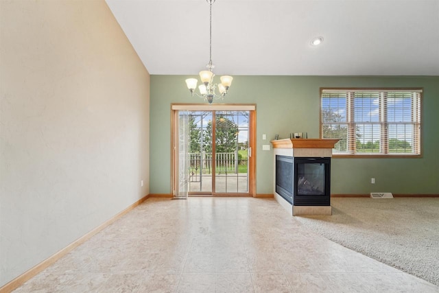 536 Coonen Dr, Combined Locks, WI 54113 - unfurnished dining area with a chandelier, a multi sided fireplace, and baseboards