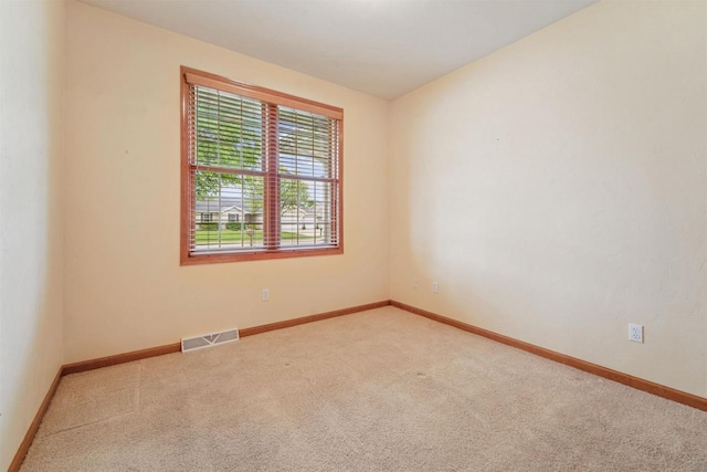 536 Coonen Dr, Combined Locks, WI 54113 - spare room featuring carpet floors and baseboards