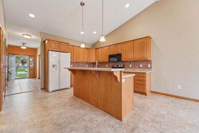 536 Coonen Dr, Combined Locks, WI 54113 - kitchen featuring white fridge with ice dispenser, black microwave, vaulted ceiling, decorative backsplash, and a breakfast bar area