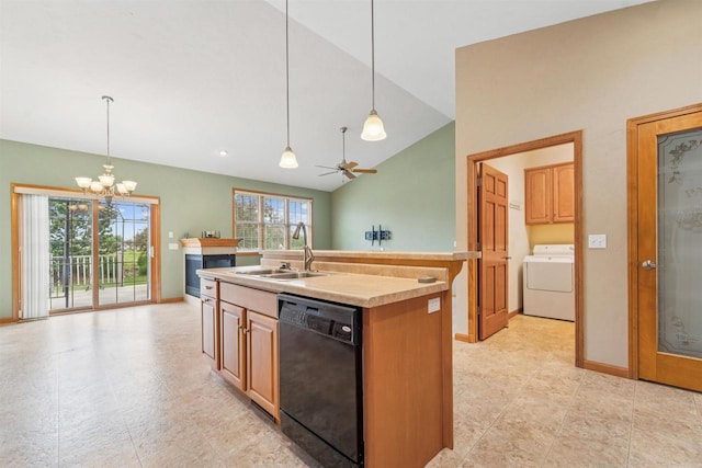 536 Coonen Dr, Combined Locks, WI 54113 - kitchen with washer / dryer, black dishwasher, a sink, vaulted ceiling, and a center island with sink