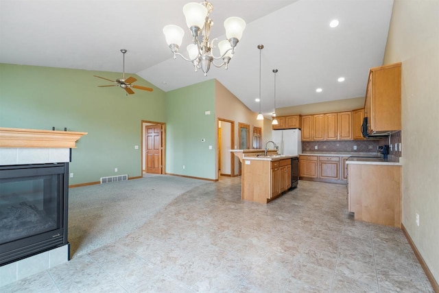 536 Coonen Dr, Combined Locks, WI 54113 - kitchen featuring open floor plan, a sink, light countertops, a ceiling fan, and high vaulted ceiling