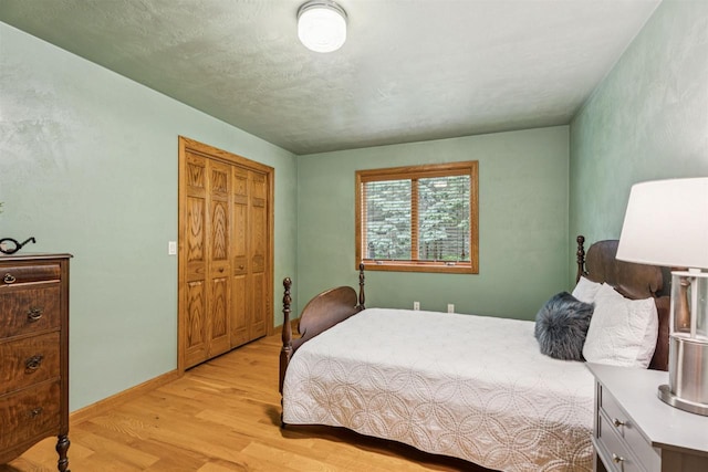 N6471 12 Corners Rd, Black Creek, WI 54106 - bedroom featuring light wood-style flooring, a closet, and baseboards