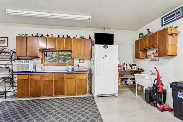 N6471 12 Corners Rd, Black Creek, WI 54106 - kitchen with freestanding refrigerator, brown cabinets, concrete floors, open shelves, and a sink