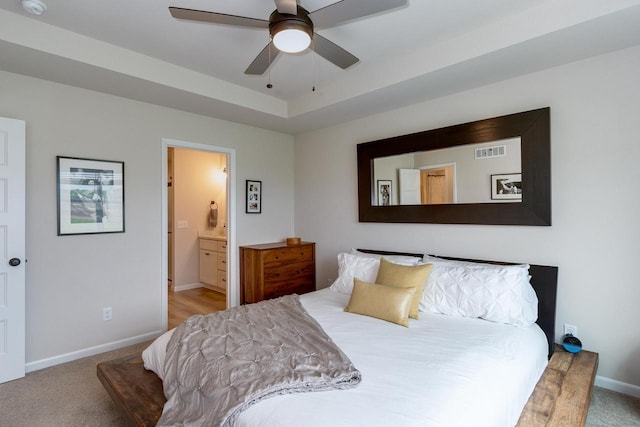447 Crusader Pt, Waunakee, WI 53597 - carpeted bedroom with baseboards, ensuite bathroom, and ceiling fan