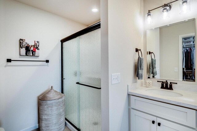 447 Crusader Pt, Waunakee, WI 53597 - bathroom featuring a shower stall, vanity, and a spacious closet