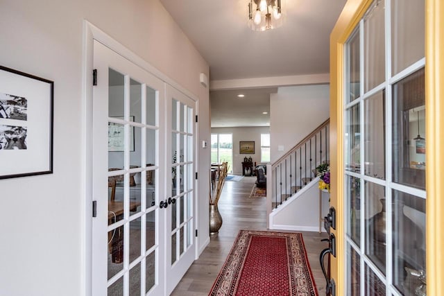 447 Crusader Pt, Waunakee, WI 53597 - entryway featuring french doors, wood finished floors, and stairway