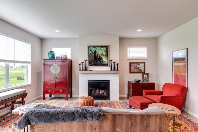 447 Crusader Pt, Waunakee, WI 53597 - living room with baseboards, recessed lighting, and a tiled fireplace