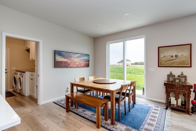 447 Crusader Pt, Waunakee, WI 53597 - dining room featuring washer and clothes dryer, light wood finished floors, baseboards, and recessed lighting