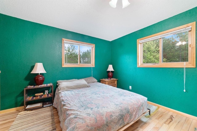 14303 Rock N Roll Ln, Gordon, WI 54838 - bedroom featuring wood finished floors and baseboards