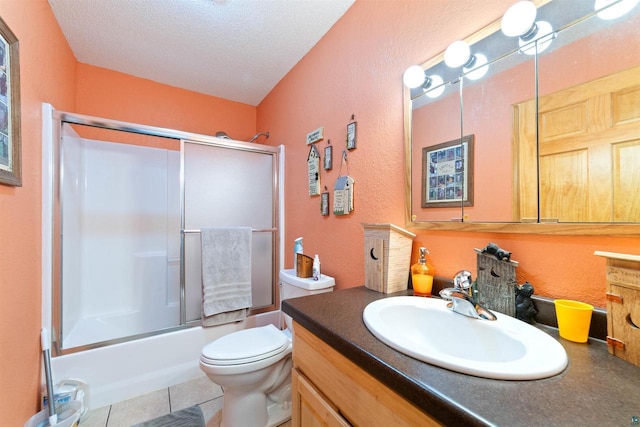 14303 Rock N Roll Ln, Gordon, WI 54838 - bathroom featuring vanity, a textured wall, toilet, combined bath / shower with glass door, and a textured ceiling