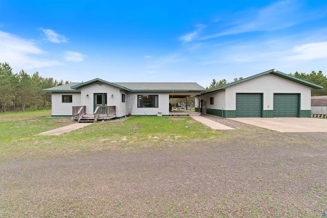 14303 Rock N Roll Ln, Gordon, WI 54838 - view of front of property with an outdoor structure, a detached garage, and a front yard