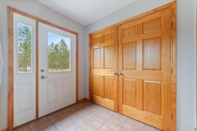 14303 Rock N Roll Ln, Gordon, WI 54838 - entrance foyer featuring light tile patterned floors and baseboards