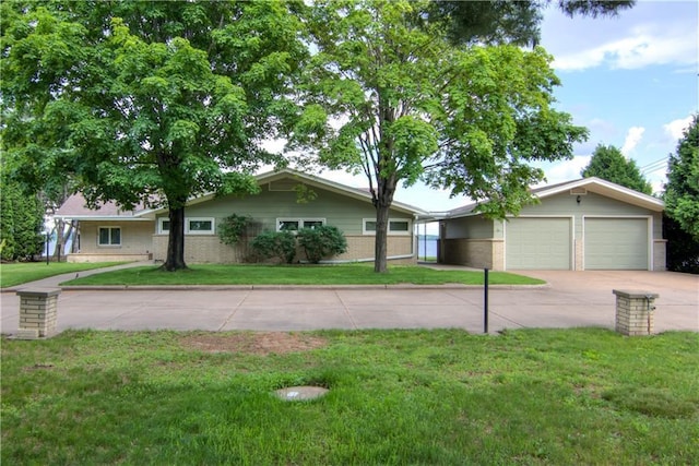 8303 163rd St, Chippewa Falls, WI 54729 - single story home with driveway, brick siding, and a front lawn