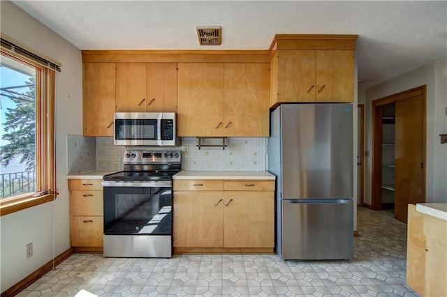 8303 163rd St, Chippewa Falls, WI 54729 - kitchen with appliances with stainless steel finishes, light countertops, and healthy amount of natural light
